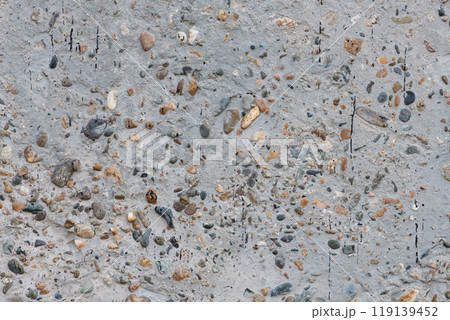 Texture of concrete surface with multicolored pebbles Texture of concrete surface with multicolored pebbles 119139452