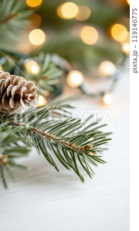 Festive Pine Tree Branch with Glowing Bokeh Lights in Winter Wonderland 119140775