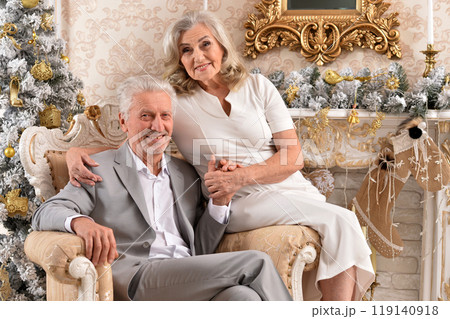 couple old and mature seniors enjoying and having fun together celebrating the new year  119140918