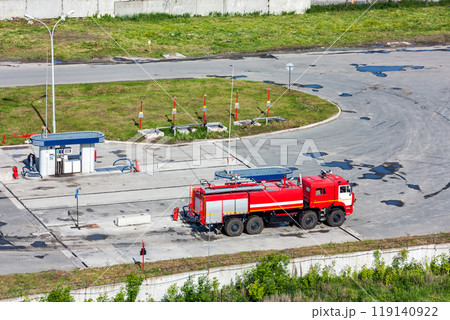 Airfield fire truck at a gas station Airfield fire truck at a gas station 119140922