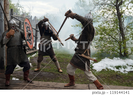 Reenacting Medieval Battle Scene in Outdoor Setting Reenacting Medieval Battle Scene in Outdoor Setting 119144141