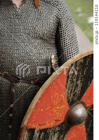 Person Wearing Chainmail Armor and Holding Shield 119144218