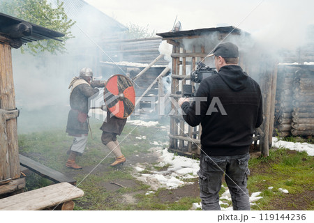 Filming Historical Battle Scene Near Wooden Structures Filming Historical Battle Scene Near Wooden Structures 119144236