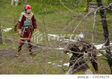 Participating in Medieval Battle Reenactment Outdoors Participating in Medieval Battle Reenactment Outdoors 119144270