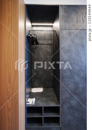 A modern open wardrobe with a dark matte finish A modern open wardrobe with a dark matte finish 119144644