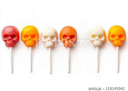 Colorful skull shaped lollipops on white background. Concept of Halloween treats and festive candy 119145042