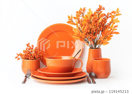 Autumn table setting with bowls, plates, wine glasses, pumpkins and floral centerpiece in vase on soft focus background. 119145213