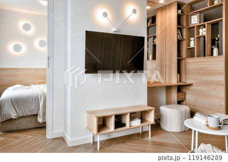 A Contemporary Modern Living Room Featuring an Inviting Cozy Design with a Sleek TV Unit A Contemporary Modern Living Room Featuring an Inviting Cozy Design with a Sleek TV Unit 119146289
