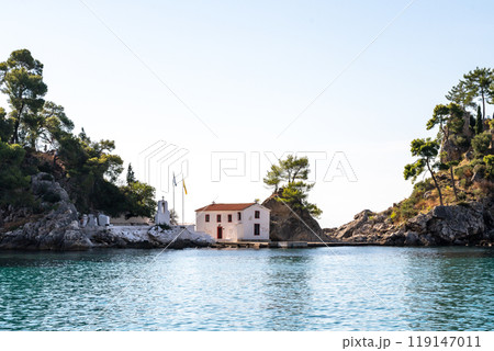 Greece Parga. Panagia island off the coast of Parga, small chapel and trees on the rock 119147011