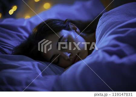 Young woman sleeping in bed in twilight 119147831