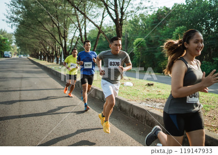 female runner participating on marathon event female runner participating on marathon event 119147933