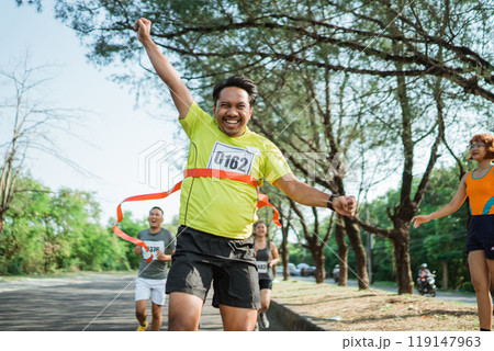 happy marathon winner with hands up gesture happy marathon winner with hands up gesture 119147963