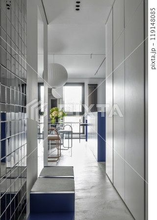 The modern and stylish design of an interior hallway embraces a minimalist aesthetic perfectly The modern and stylish design of an interior hallway embraces a minimalist aesthetic perfectly 119148085