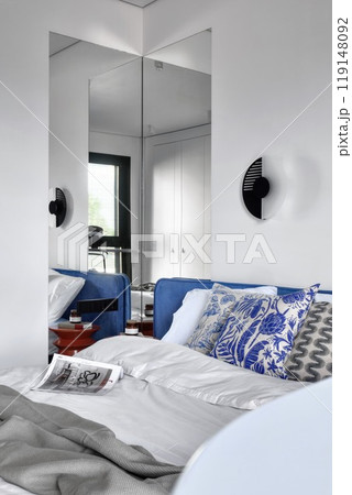 A Modern Bedroom featuring Stylish Decor and Elegant Touches that enhance the atmosphere A Modern Bedroom featuring Stylish Decor and Elegant Touches that enhance the atmosphere 119148092