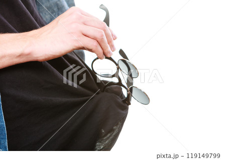 Man cleaning glasses on black t shirt Man cleaning glasses on black t shirt 119149799