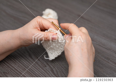 female hands knitting close up female hands knitting close up 119150363