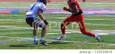 Football wide receiver making a move at the start of a play during a game 119150628