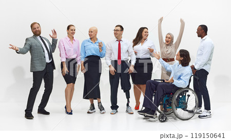 Diverse group of colleagues engage in lively conversation, smiling and gesturing. Collaboration and acceptance in a professional setting. Diverse group of colleagues engage in lively conversation, smiling and gesturing. Collaboration and acceptance in a professional setting. 119150641