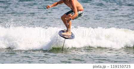 Man hydro foiling on a kite board 119150725