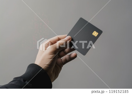 A woman's hand holding a black square on a bank card, Credit card female hand holding 119152185