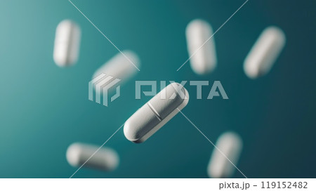 Floating White Pills on a Blue Background Floating White Pills on a Blue Background 119152482