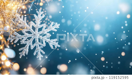A beautiful snowflake floats gracefully against a sparkling blue background, capturing the essence of winter magic and festive cheer. 119152595