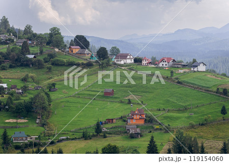 Scenic rural landscape of Vorokhta village in Carpathian Mountains, showcasing traditional houses. 119154060