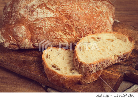 sliced ciabatta , on a chopping board, italian bread, close-up, Italian cuisine, breakfast, no people, sliced ciabatta , on a chopping board, italian bread, close-up, Italian cuisine, breakfast, no people, 119154266