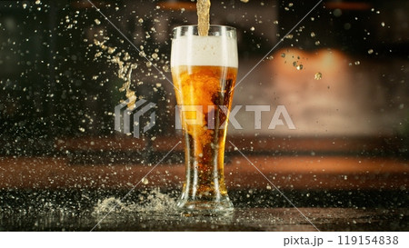 Pouring Beer Drink into a Long Glass. Pouring Beer Drink into a Long Glass. 119154838