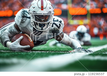 An American football player runs down field with ball in team game of national sport at stadium. 119156537