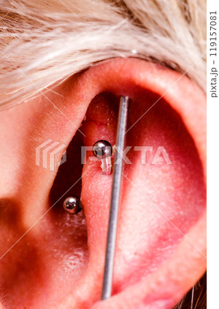 Pierced man ear, black plug tunnel, industrial and rook 119157081