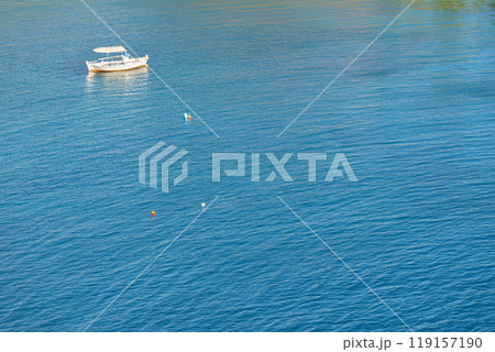Boat on calm sea water Boat on calm sea water 119157190