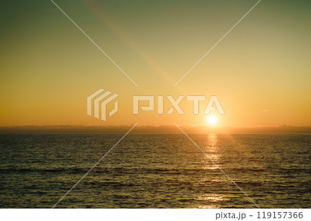 Sunset or sunrise over sea surface Sunset or sunrise over sea surface 119157366