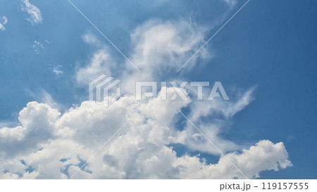 White clouds on the blue sky perfect for the background. Clear blue sky and white clouds. Blue sky background with clouds. White clouds on the blue sky perfect for the background. Clear blue sky and white clouds. Blue sky background with clouds. 119157555
