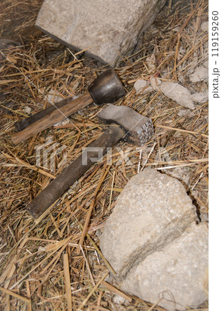Mason tools at a medieval festival in Portugal for working with stone. Concept for reconstructing historical crafts. 119159260