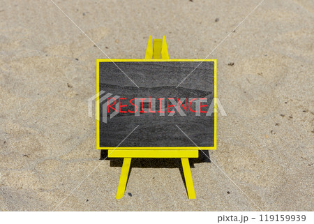 Resilience symbol. Concept word Resilience on beautiful chalk blackboard. Beautiful sand beach background. Business resilience concept. Copy space. Resilience symbol. Concept word Resilience on beautiful chalk blackboard. Beautiful sand beach background. Business resilience concept. Copy space. 119159939