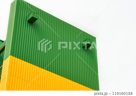 Metal yellow green profile closing the facade, construction structure 119160188