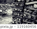 薪が積んである秋の田舎風景 119160456