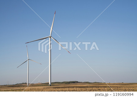 Wind turbines on an agricultural field. Sustainable energy 119160994