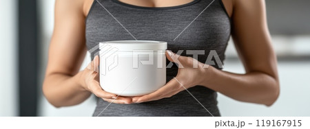Health Journey: A container with a blank white label, woman's abdomen symbolizing wellness, fitness, body goals, highlighting weight loss, exercise, tools aiding slimming progress. 119167915