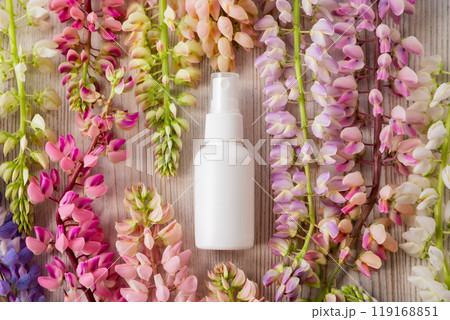 cosmetic spray bottle, lupine flowers a lot. Antibacterial liquid, natural organic oil, body mist, sanitizer, perfume, sunscreen, deodorant. skincare product blank package, cosmetology product mockup 119168851