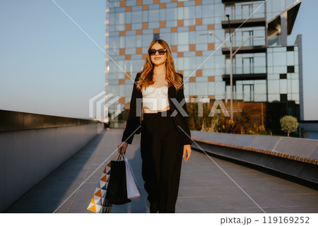 Woman Shopping in Urban Area Woman Shopping in Urban Area 119169252