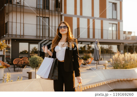 Young Woman Shopping Outdoors Young Woman Shopping Outdoors 119169260