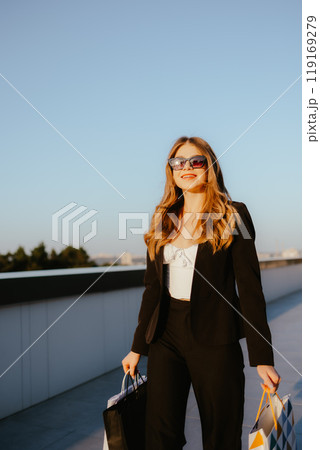 Woman Shopping Outdoors in Sunlight 119169279