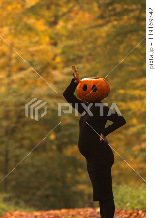Surreal Autumn Scene with Pumpkin Head Surreal Autumn Scene with Pumpkin Head 119169342