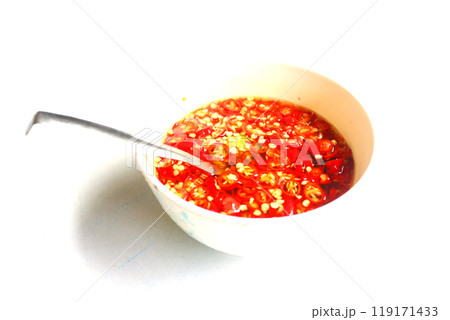 Fish sauce and red chilli in cup with spoon. 119171433