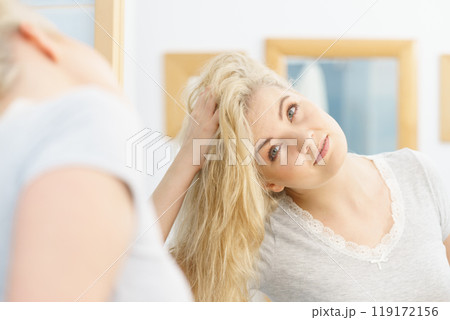 Woman with wet blonde hair Woman with wet blonde hair 119172156