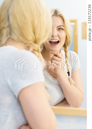 Lovely blonde woman in braids Lovely blonde woman in braids 119172236