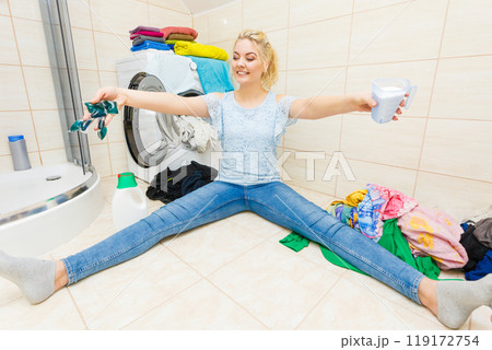 Girl wash laundry with different detergent. Girl wash laundry with different detergent. 119172754