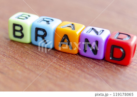 Brand text multicolor cubes on wooden table Brand text multicolor cubes on wooden table 119178065
